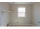 Laundry room with shelving and a window at 1121 E Jahns Dr, Casa Grande, AZ 85122