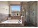 Bathroom with a large soaking tub and walk in shower at 7514 E Oasis Cir, Mesa, AZ 85207