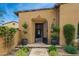 Inviting entryway with ornate iron gate and landscaping at 20226 N 101St Way, Scottsdale, AZ 85255