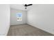 Well-lit bedroom featuring neutral walls and carpet, plus a window with blinds at 7245 S 75Th Dr, Laveen, AZ 85339