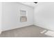 Bright bedroom with neutral carpet and large window with blinds at 7245 S 75Th Dr, Laveen, AZ 85339