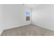 Spacious bedroom with neutral carpeting and a large window at 7245 S 75Th Dr, Laveen, AZ 85339