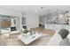 Open concept living space with kitchen view, white sofas and a coffee table at 7245 S 75Th Dr, Laveen, AZ 85339