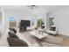 Open living area with vaulted ceiling, comfy seating and large windows at 7245 S 75Th Dr, Laveen, AZ 85339