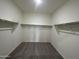 Large walk-in closet with ample shelving and hanging space at 13213 E Larrea Ln, Florence, AZ 85132