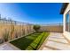 Artificial turf backyard with flagstone walkway and desert landscaping at 23874 N 123Rd Pl, Scottsdale, AZ 85255