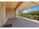 Covered patio extends from house to backyard at 25807 N 19Th Gln, Phoenix, AZ 85085