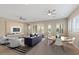 Open living and dining area with neutral decor and ceiling fans at 25807 N 19Th Gln, Phoenix, AZ 85085