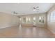 Spacious living room featuring tile floors and ceiling fans at 25807 N 19Th Gln, Phoenix, AZ 85085