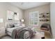 Comfortable bedroom with window shutters and a cozy sitting area at 25807 N 19Th Gln, Phoenix, AZ 85085