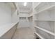 Large walk-in closet with ample shelving and hanging space at 25807 N 19Th Gln, Phoenix, AZ 85085
