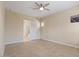 Spacious bedroom with tile floors and ensuite bathroom access at 25807 N 19Th Gln, Phoenix, AZ 85085