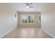 Bright and airy living room with tile floors and large windows at 25807 N 19Th Gln, Phoenix, AZ 85085