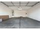 Unfinished two-car garage with door opener at 16755 W Cameron Dr, Surprise, AZ 85388