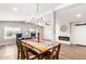 Farmhouse-style dining area with wood table and fireplace at 427 S 80Th Way, Mesa, AZ 85208