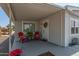 Covered porch with seating area and potted plants at 427 S 80Th Way, Mesa, AZ 85208