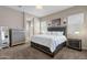 Main bedroom with plush carpeting and ensuite bathroom at 2126 W Red Fox Rd, Phoenix, AZ 85085