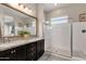 Elegant bathroom with double sinks, granite counters, and a large shower at 2126 W Red Fox Rd, Phoenix, AZ 85085