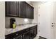 Well-equipped kitchen with granite countertop and cabinets at 2126 W Red Fox Rd, Phoenix, AZ 85085