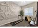 Home office features a treadmill, desk, and inspiring wall art at 2126 W Red Fox Rd, Phoenix, AZ 85085