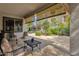 Covered patio with seating area and views of backyard at 2126 W Red Fox Rd, Phoenix, AZ 85085