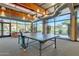 Community room with ping pong table and comfortable seating area at 2126 W Red Fox Rd, Phoenix, AZ 85085