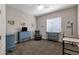 Cozy bedroom with wood-framed bed and ample natural light at 2126 W Red Fox Rd, Phoenix, AZ 85085