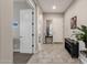 Bright and airy entryway with tile floors and a view to the living area at 2126 W Red Fox Rd, Phoenix, AZ 85085