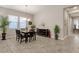 Bright dining room with tile floors and chandelier at 2126 W Red Fox Rd, Phoenix, AZ 85085