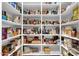 Large pantry with ample shelving for storage at 2126 W Red Fox Rd, Phoenix, AZ 85085