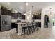 Open kitchen with island and breakfast bar seating at 2126 W Red Fox Rd, Phoenix, AZ 85085