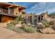 Community center waterfall feature with large rocks and desert plants at 2126 W Red Fox Rd, Phoenix, AZ 85085