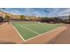 Two lighted tennis courts with green playing surfaces at 2126 W Red Fox Rd, Phoenix, AZ 85085