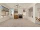 Living room with fireplace, built-in shelving, and large windows at 15210 S 20Th St, Phoenix, AZ 85048