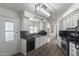 Modern kitchen featuring white cabinets, dark countertops, and stainless steel appliances at 201 S Greenfield Rd # 324, Mesa, AZ 85206