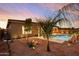 Relaxing backyard with a sparkling pool and desert landscaping at 15175 S 185Th Ave, Goodyear, AZ 85338