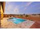 Inviting rectangular pool with a spa and large tile patio at 15175 S 185Th Ave, Goodyear, AZ 85338