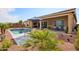 Inviting backyard pool with patio furniture and covered patio at 15175 S 185Th Ave, Goodyear, AZ 85338