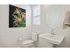 Small bathroom with white pedestal sink and toilet at 15175 S 185Th Ave, Goodyear, AZ 85338