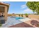 Resort-style backyard oasis featuring a sparkling pool and expansive patio at 15175 S 185Th Ave, Goodyear, AZ 85338