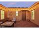 Cozy courtyard featuring a fire pit, comfortable seating, and string lights at 15175 S 185Th Ave, Goodyear, AZ 85338