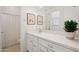 Clean bathroom with single vanity, large mirror and shower/tub combo at 15175 S 185Th Ave, Goodyear, AZ 85338