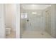 Large walk-in shower with glass enclosure at 15175 S 185Th Ave, Goodyear, AZ 85338