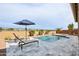 Relaxing backyard oasis with a refreshing pool and lounge chairs at 15175 S 185Th Ave, Goodyear, AZ 85338