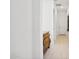 Bright hallway with wood-toned dresser and light tile floors at 15175 S 185Th Ave, Goodyear, AZ 85338