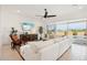 Bright living room with sectional sofa and pool view at 15175 S 185Th Ave, Goodyear, AZ 85338