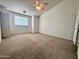 Large bedroom with neutral decor, carpet, and ample natural light at 19422 N 67Th Ln, Glendale, AZ 85308