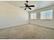 Spacious bedroom with neutral walls, carpet flooring, and ceiling fan at 19422 N 67Th Ln, Glendale, AZ 85308