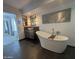 Bathroom features a freestanding tub, double sinks, and modern decor at 19422 N 67Th Ln, Glendale, AZ 85308