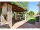 Relaxing patio area with pergola covered seating at 19422 N 67Th Ln, Glendale, AZ 85308